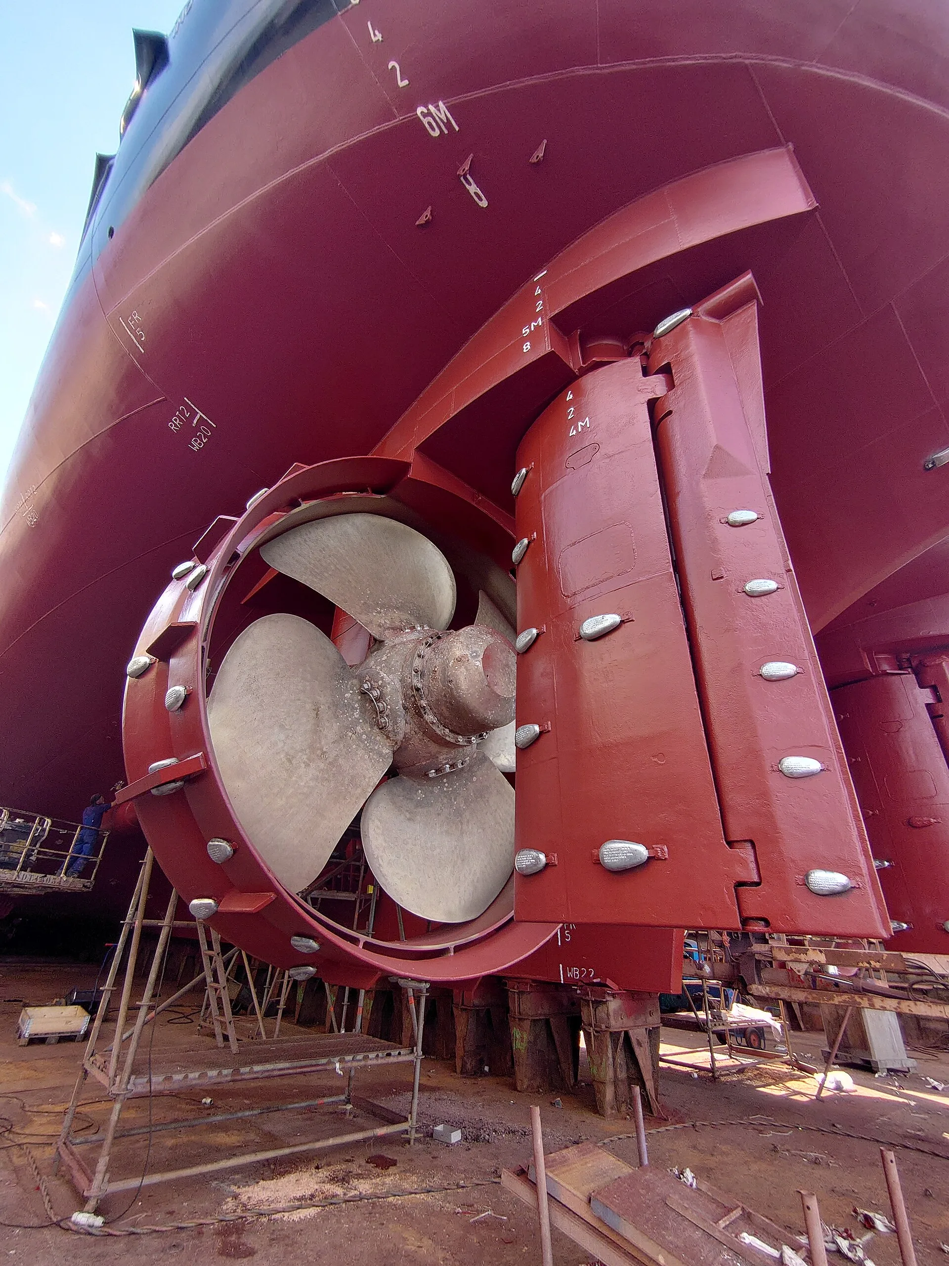 Ship propeller, nozzle and rudder in dry dock with bolted sacrificial anodes for cathodic protection