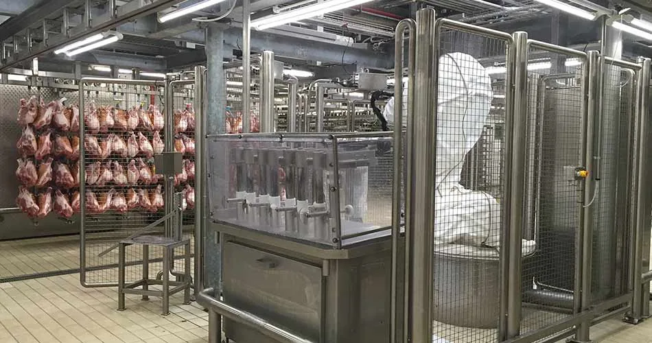 Stainless machine guard panels and protective screens with bolted frame connections in a food-processing line